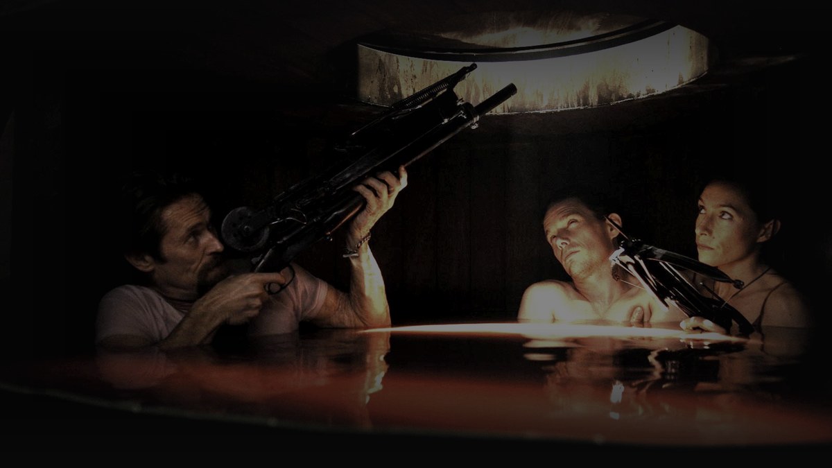 Still from Daybreakers (2009) — tmdb backdrop (movie 19901, key tt02c9m7Seu25zg3OhJk4u8MA1W); genuine film still, the blood-tank hideout scene. source luma 24.3, pre-brightened 2.6x, baked at factor 0.45, lanczos to 1200x675, on-disk luma 20.8