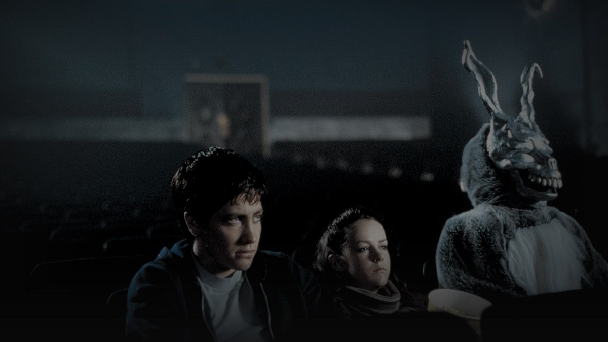 Still from Donnie Darko (2001) — TMDB still from Donnie Darko (2001), checked against a distinct Letterboxd still; baked through scripts/bake_dark_photo.py at factor 0.45, output brightness 25.1